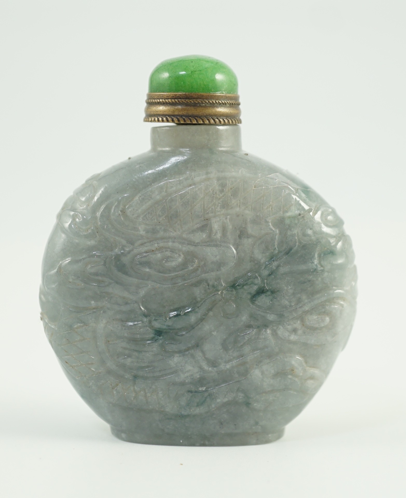 A Chinese jadeite ‘dragon’ snuff bottle, c.1800-1900, 4.9cm high, jadeite mounted stopper